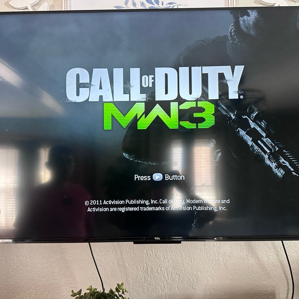TCL Black and Green Video Game Console with Call of Duty MW3